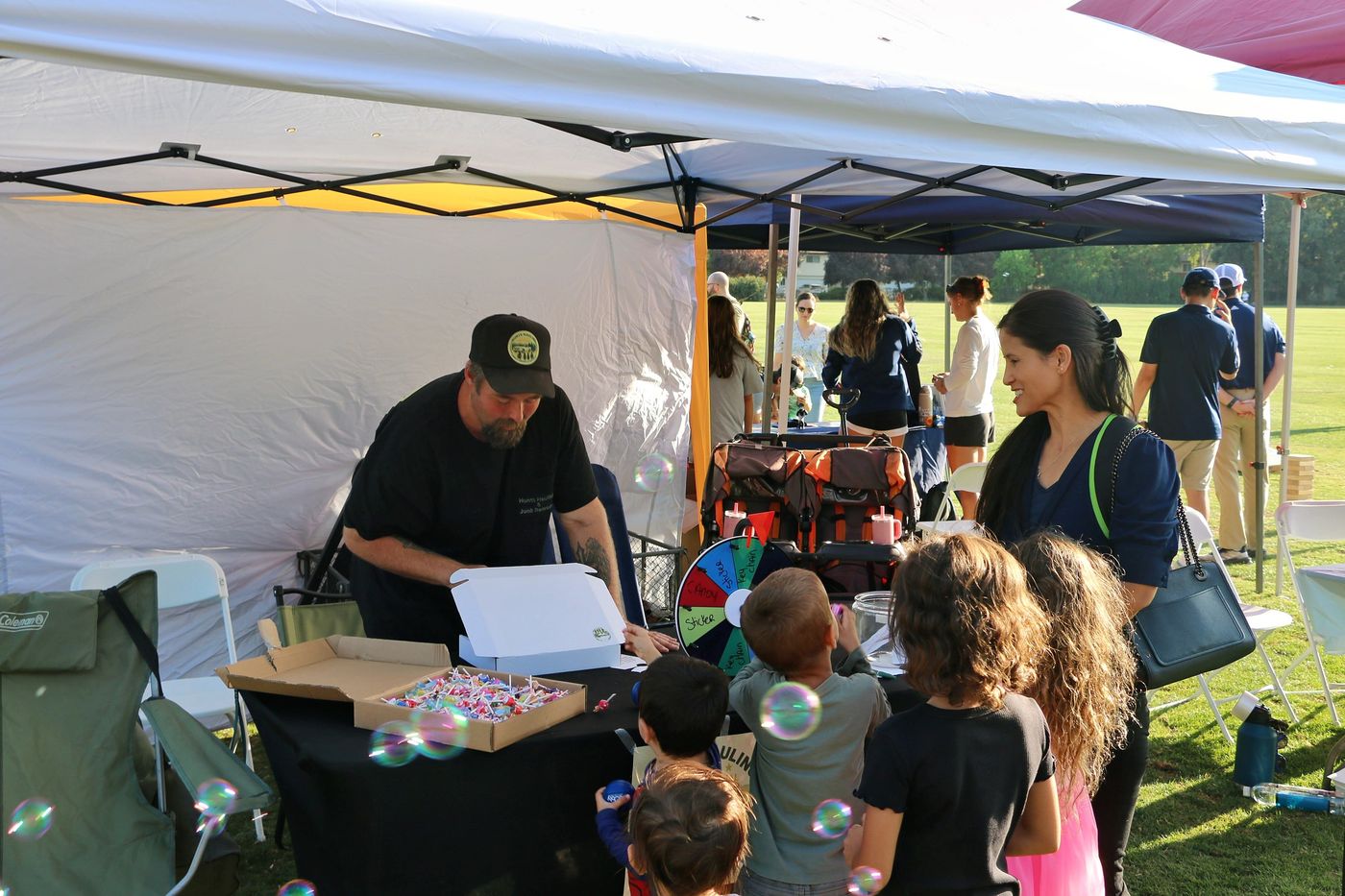 A family playing with bubbles at Celebrate Davis