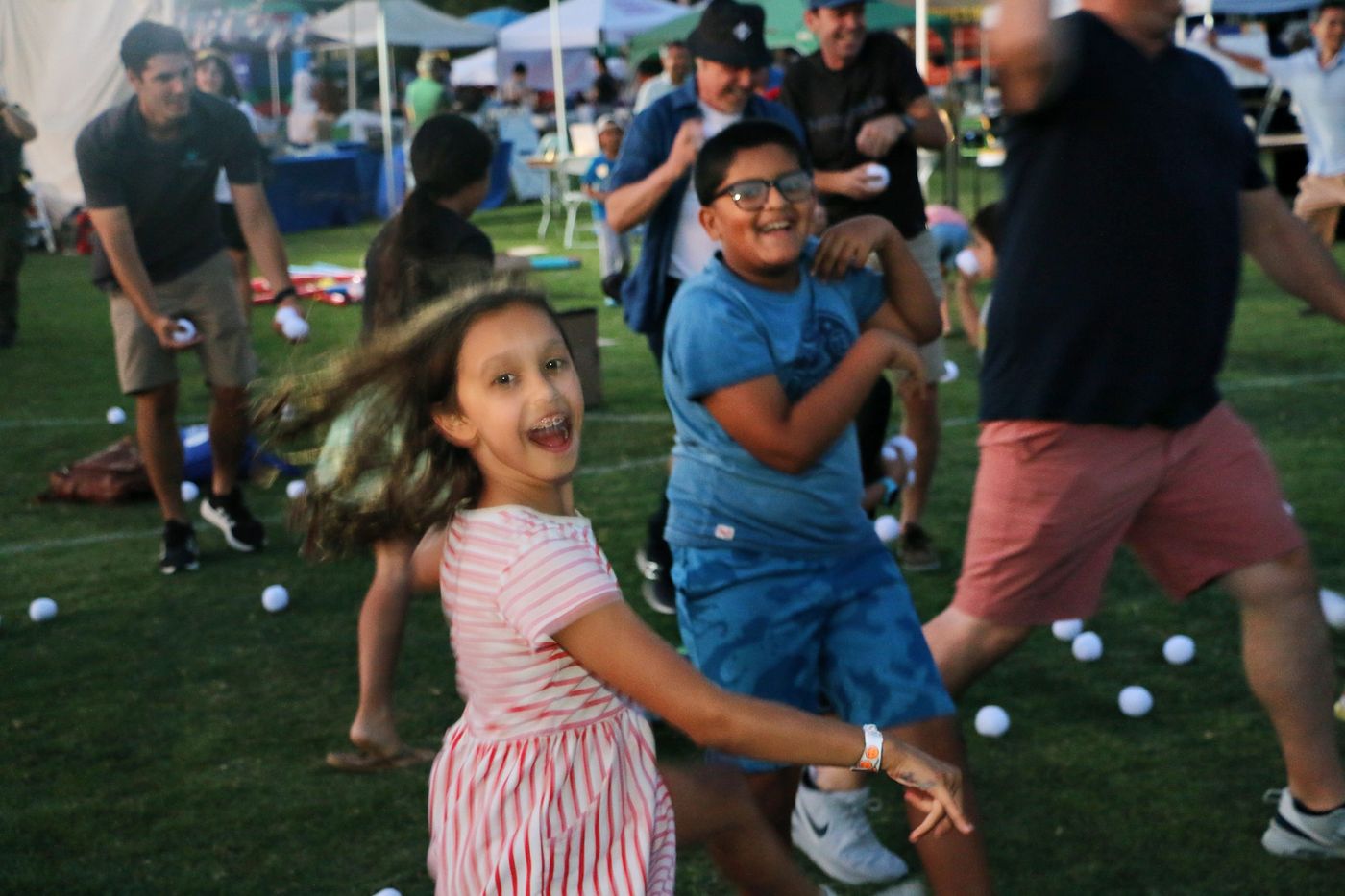A child spinning with joy at Celebrate Davis