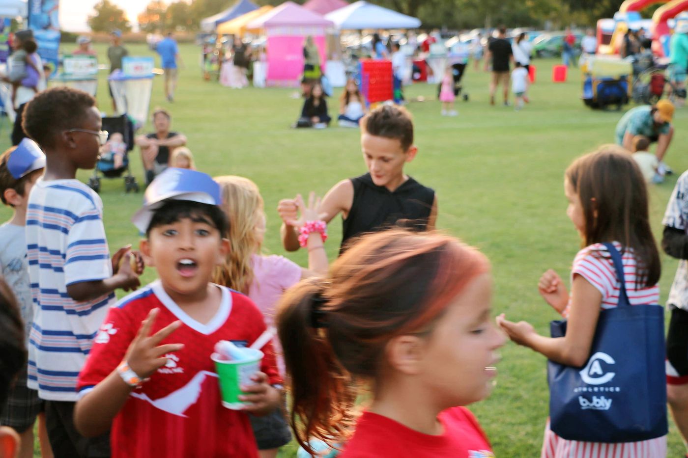 Children dancing joyfully at a Davis community event